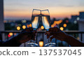 Champagne Toast at Sunset on City Balcony 137537045