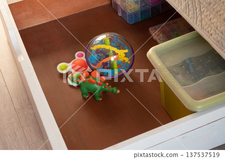 Children's toy drawer with dinosaur, puzzle ball, and fidget spinner Children's toy drawer with dinosaur, puzzle ball, and fidget spinner 137537519