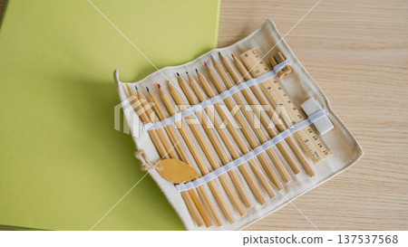 Eco-friendly pencil set with ruler on wooden desk Eco-friendly pencil set with ruler on wooden desk 137537568