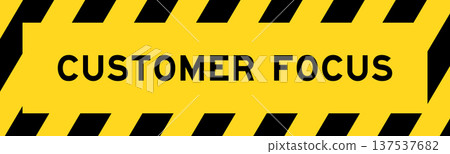 Yellow and black color with line striped label banner with word customer focus 137537682