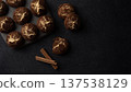 Cinnamon crinkle cookies on a black background with copy space, flat lay 137538129