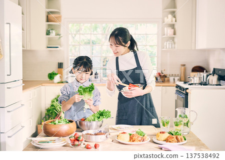 Parents who cook in the kitchen 137538492