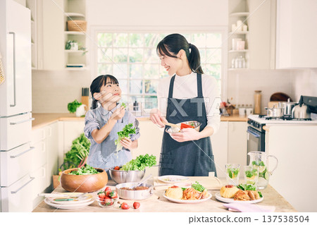 Parents who cook in the kitchen Parents who cook in the kitchen 137538504