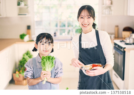 Parents who cook in the kitchen Parents who cook in the kitchen 137538518