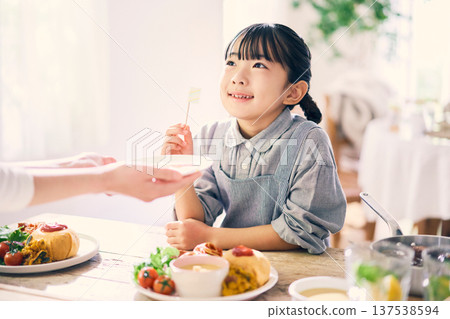 Girl helping with meals 137538594