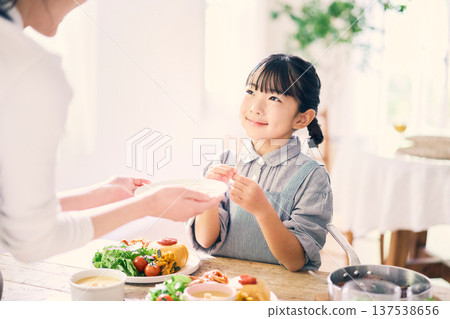 Girl helping with meals Girl helping with meals 137538656