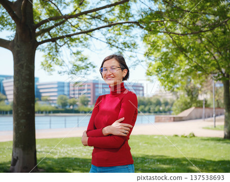 Woman in glasses stands in center of Frankfurt, 137538693