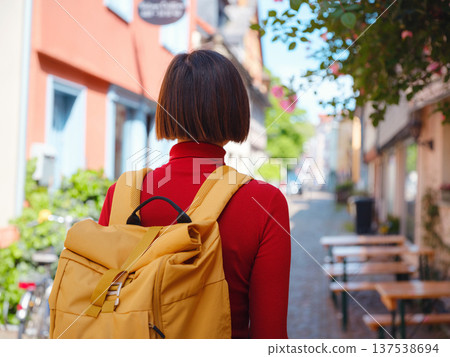 Tourist woman enjoys historic charm of Hochst near Frankfurt 137538694