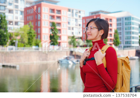 Tourist woman explores modern Frankfurt, 137538704