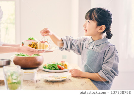 Girl helping with meal preparation 137538798