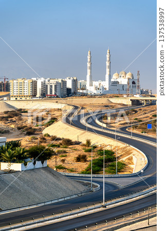 Scenic view of the iconic Mohammed Al Ameen Mosque overlooking modern highway infrastructure in Bawshar, Muscat, Oman in the Middle East 137538997