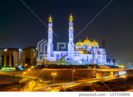 Illuminated architecture of the Mohammed Al Ameen Mosque at night, featuring traditional Islamic domes and minarets in Bawshar, Muscat, Oman, Illuminated architecture of the Mohammed Al Ameen Mosque at night, featuring traditional Islamic domes and minarets in Bawshar, Muscat, Oman, 137538998
