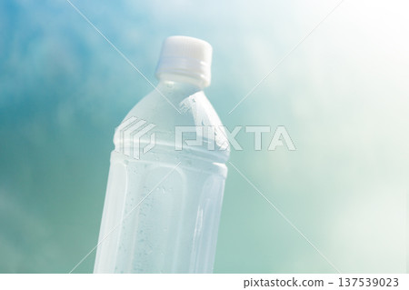 A plastic bottle of refreshing cold mineral water with water droplets - a heatstroke prevention and hydration image A plastic bottle of refreshing cold mineral water with water droplets - a heatstroke prevention and hydration image 137539023