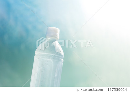 A plastic bottle of refreshing cold mineral water with water droplets - a heatstroke prevention and hydration image A plastic bottle of refreshing cold mineral water with water droplets - a heatstroke prevention and hydration image 137539024