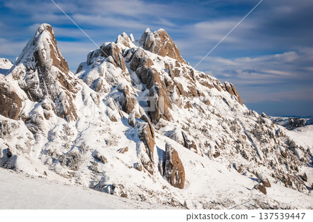 Carpathian Mountains, Romania. Snow-covered rocky peaks in Ciucas Massif. Carpathian Mountains, Romania. Snow-covered rocky peaks in Ciucas Massif. 137539447