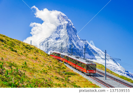 Zermatt, Switzerland. Gornergrat railway and Matterhorn pyramid-like mountain. Zermatt, Switzerland. Gornergrat railway and Matterhorn pyramid-like mountain. 137539555