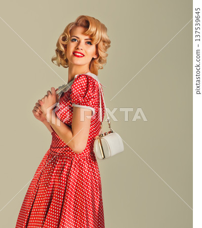 charming blonde pin-up girl with little bag 137539645