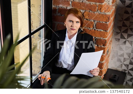 Manager analyzes applicant papers in targeted environment Manager analyzes applicant papers in targeted environment 137540172