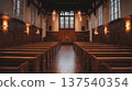 Empty wooden church interior with stained glass and altar lighting 137540354