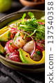 Fresh ceviche with avocado and red onion in rustic bowl 137540358