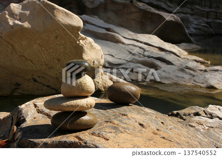 Heaps of stones by the river. 137540552