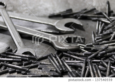 Wrench and screws. Industrial background. 137540559
