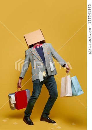 Man wearing cardboard box on head shopping sale concept 137541356