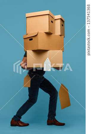 Retail sale concept man carrying stack of cardboard boxes 137541368