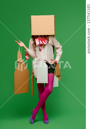 Retail sale shopper with cardboard price tags covering face 137541385