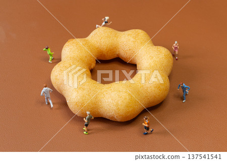 Miniature Runners Jogging Around Donut Fitness Concept Miniature Runners Jogging Around Donut Fitness Concept 137541541