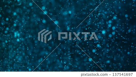 Bokeh circles. Luminosity particles. Blue shimmering stream on black night. Color flying confetti glow abstract defocused background. Bokeh circles. Luminosity particles. Blue shimmering stream on black night. Color flying confetti glow abstract defocused background. 137541697