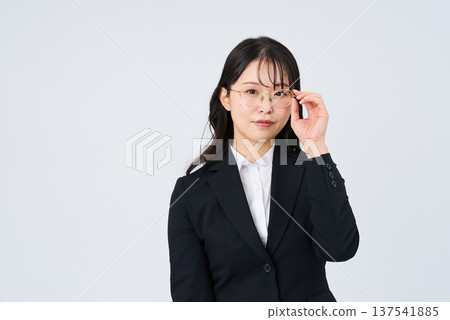 Businesswoman wearing eyeglasses Businesswoman wearing eyeglasses 137541885