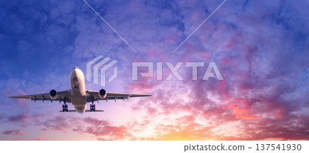 Commercial passenger airplane taking off. Aircraft at sunset 137541930