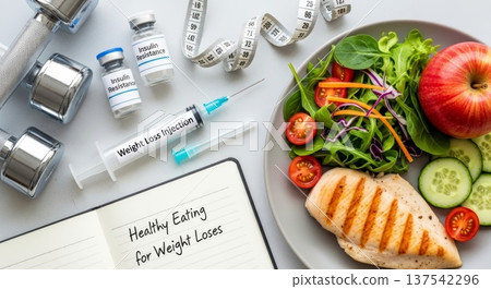 Healthy eating and weight loss injection flat lay with salad, grilled chicken and dumbbell for diet background and wellness design Healthy eating and weight loss injection flat lay with salad, grilled chicken and dumbbell for diet background and wellness design 137542296