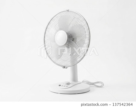 Small White Electric Desktop Appliance Circulating Air for Personal Cooling on a Clean Light Background 137542364