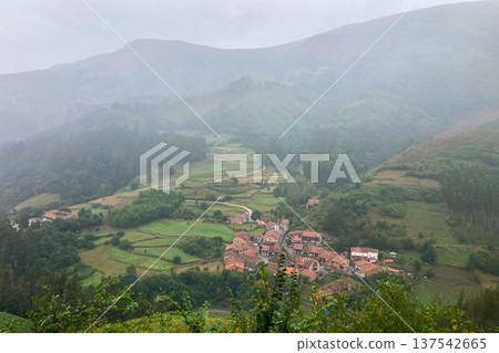 Picturesque landscapes with rolling green hills and mountains in the highlands of Cantabria, Spain. Picturesque landscapes with rolling green hills and mountains in the highlands of Cantabria, Spain. 137542665