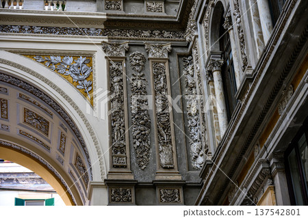 Interior of the Galleria Umberto I in Naples,Italy.Intricate architectural details inside the Galleria Umberto I,Naples,Italy,highlight ornate stucco reliefs and decorative moldings Interior of the Galleria Umberto I in Naples,Italy.Intricate architectural details inside the Galleria Umberto I,Naples,Italy,highlight ornate stucco reliefs and decorative moldings 137542801