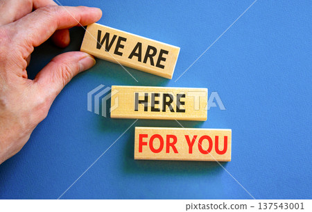 Support, help and we are here for you symbol. Concept words We are here for you on beautiful blocks. Beautiful blue background. Businessman's hand. Business we are here for you concept. Copy space. Support, help and we are here for you symbol. Concept words We are here for you on beautiful blocks. Beautiful blue background. Businessman's hand. Business we are here for you concept. Copy space. 137543001