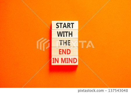 Start with the end in mind symbol. Concept words Start with the end in mind on beautiful wooden blocks. Beautiful orange paper background. Business start with the end in mind concept. Copy space. Start with the end in mind symbol. Concept words Start with the end in mind on beautiful wooden blocks. Beautiful orange paper background. Business start with the end in mind concept. Copy space. 137543048