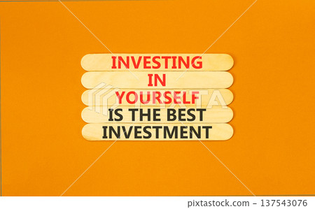 Investing in yourself symbol. Concept words Investing in yourself is the best investment on beautiful wooden sticks. Beautiful orange background. Business investing in yourself concept. Copy space Investing in yourself symbol. Concept words Investing in yourself is the best investment on beautiful wooden sticks. Beautiful orange background. Business investing in yourself concept. Copy space 137543076
