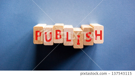 Publish word symbol. Concept word Publish on beautiful wooden blocks. Beautiful blue background. Business publish word concept. Copy space. 137543115