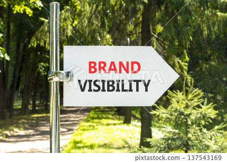 Brand visibility symbol. Concept words Brand visibility on beautiful big white road sign. Beautiful green forest garden trees background. Business branding and brand visibility concept. Copy space. Brand visibility symbol. Concept words Brand visibility on beautiful big white road sign. Beautiful green forest garden trees background. Business branding and brand visibility concept. Copy space. 137543169
