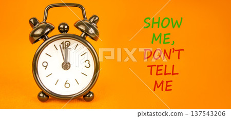 Tell or show symbol. Concept words Show me, do not tell me on beautiful orange paper. Beautiful orange paper background. Business tell or show concept. Copy space. Tell or show symbol. Concept words Show me, do not tell me on beautiful orange paper. Beautiful orange paper background. Business tell or show concept. Copy space. 137543206