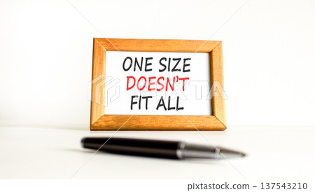 One size does not fit all symbol. Concept words One size does not fit all on beautiful wooden picture frame. Beautiful white background. Business one size does not fit all concept. Copy space. One size does not fit all symbol. Concept words One size does not fit all on beautiful wooden picture frame. Beautiful white background. Business one size does not fit all concept. Copy space. 137543210