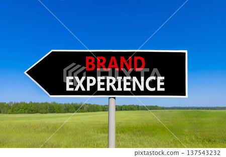 Brand experience symbol. Concept words Brand experience on beautiful black road sign. Beautiful blue sky green grass field background. Business branding and brand experience concept. Copy space. Brand experience symbol. Concept words Brand experience on beautiful black road sign. Beautiful blue sky green grass field background. Business branding and brand experience concept. Copy space. 137543232
