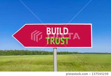 Build trust symbol. Concept words Build trust on beautiful red road sign. Beautiful blue sky green grass field background. Business and build trust concept, copy space. Build trust symbol. Concept words Build trust on beautiful red road sign. Beautiful blue sky green grass field background. Business and build trust concept, copy space. 137543239