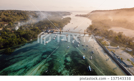 Drone view of a bridge between two islands over a narrow ocean channel. Nusa Lembongan and Nusa Ceningan bridge. Drone view of a bridge between two islands over a narrow ocean channel. Nusa Lembongan and Nusa Ceningan bridge. 137543338