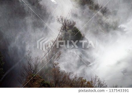 Dramatic emergency water release cascading from a reservoir after heavy rains creating powerful natural scenery in Spain. Dramatic emergency water release cascading from a reservoir after heavy rains creating powerful natural scenery in Spain. 137543391