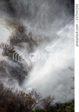 Dramatic emergency water release cascading from a reservoir after heavy rains creating powerful natural scenery in Spain. Dramatic emergency water release cascading from a reservoir after heavy rains creating powerful natural scenery in Spain. 137543392
