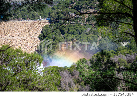 Dramatic emergency water release cascading from a reservoir after heavy rains creating powerful natural scenery in Spain. Dramatic emergency water release cascading from a reservoir after heavy rains creating powerful natural scenery in Spain. 137543394